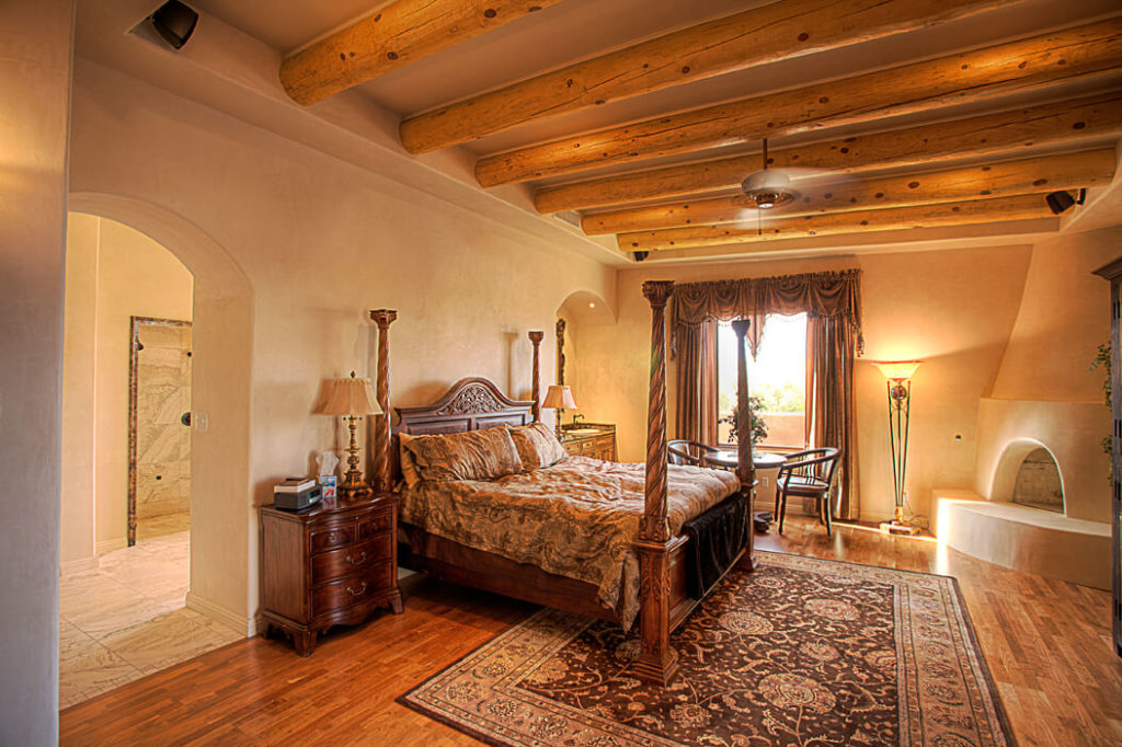 large master bedroom with wooden beams