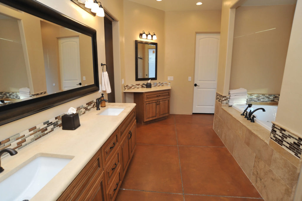 new master bathroom remodeled with double vanity and a jacuzzi