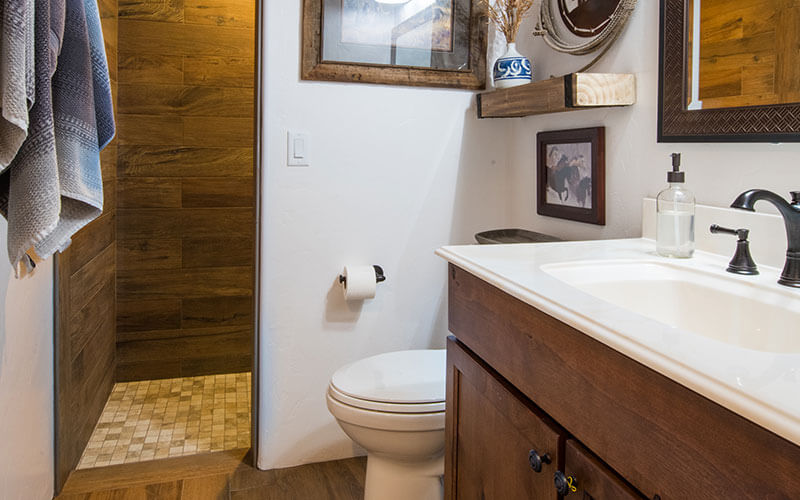 remodeled guest bathroom with walk in shower and new vanity