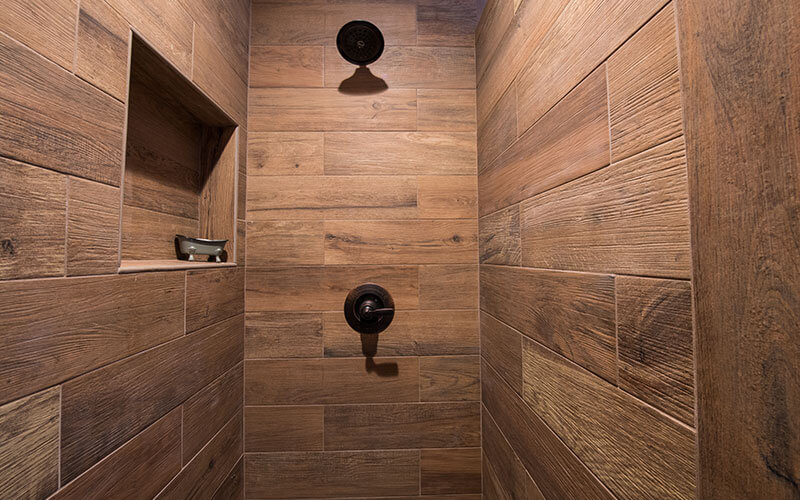 remodeled shower with wooden paneling